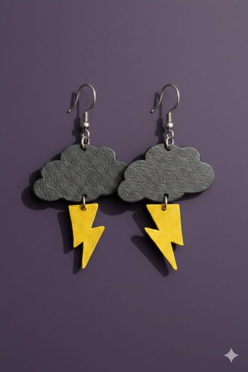A pair of stormcloud earrings - grey clouds and yellow lightning bolts made of upcycled leather